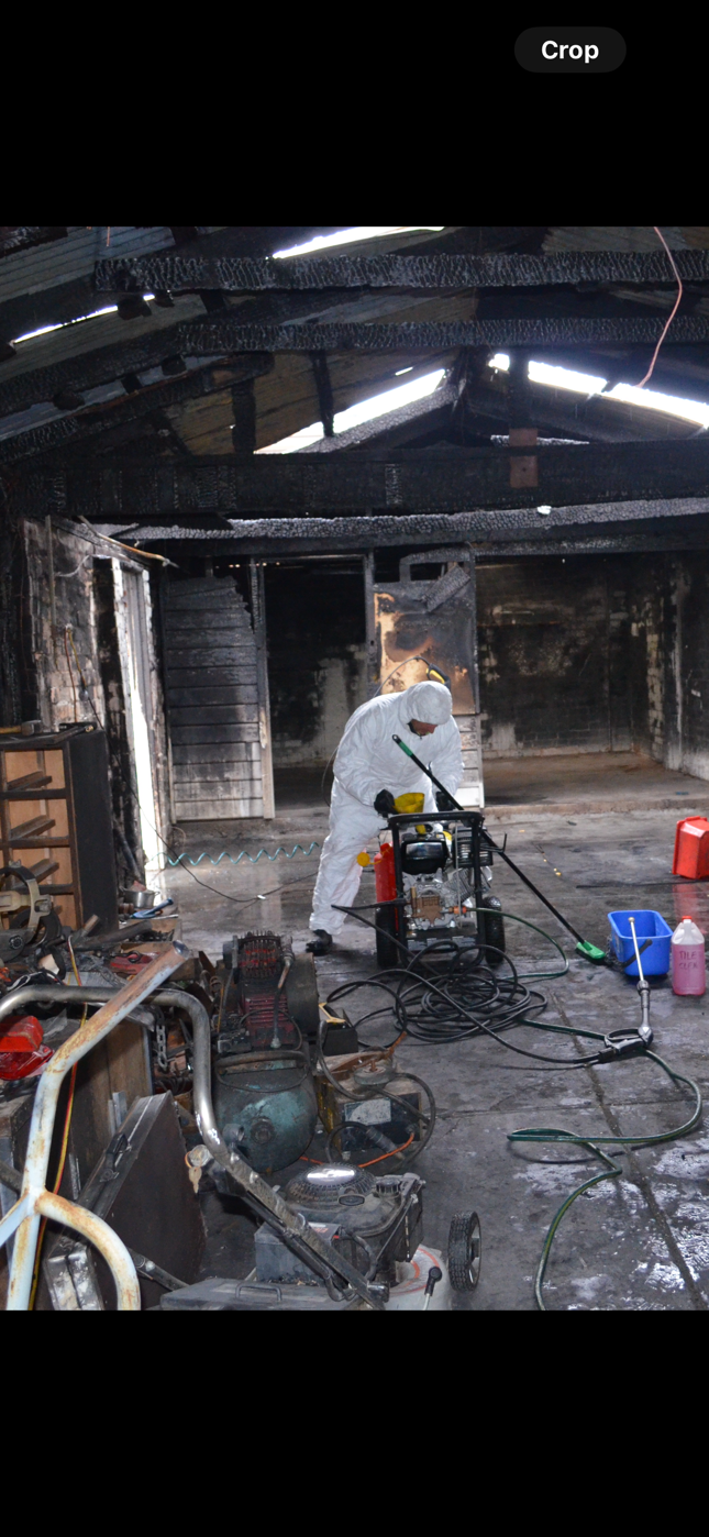 A woman is holding a little girl in her arms in a living room.