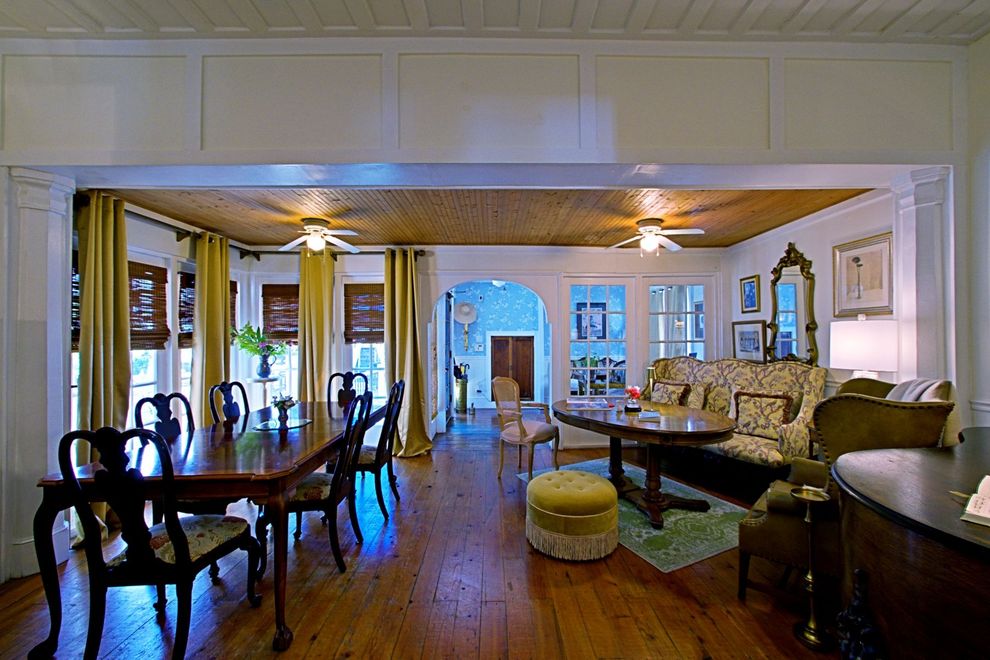 A living room with a table and chairs and a couch