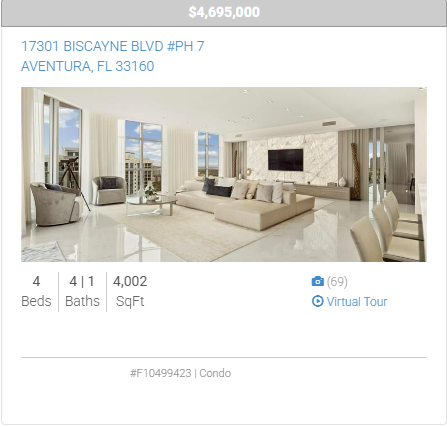 A picture of a living room with a couch and chairs