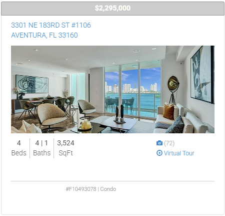 A living room with a couch , chairs and a table with a view of the ocean.