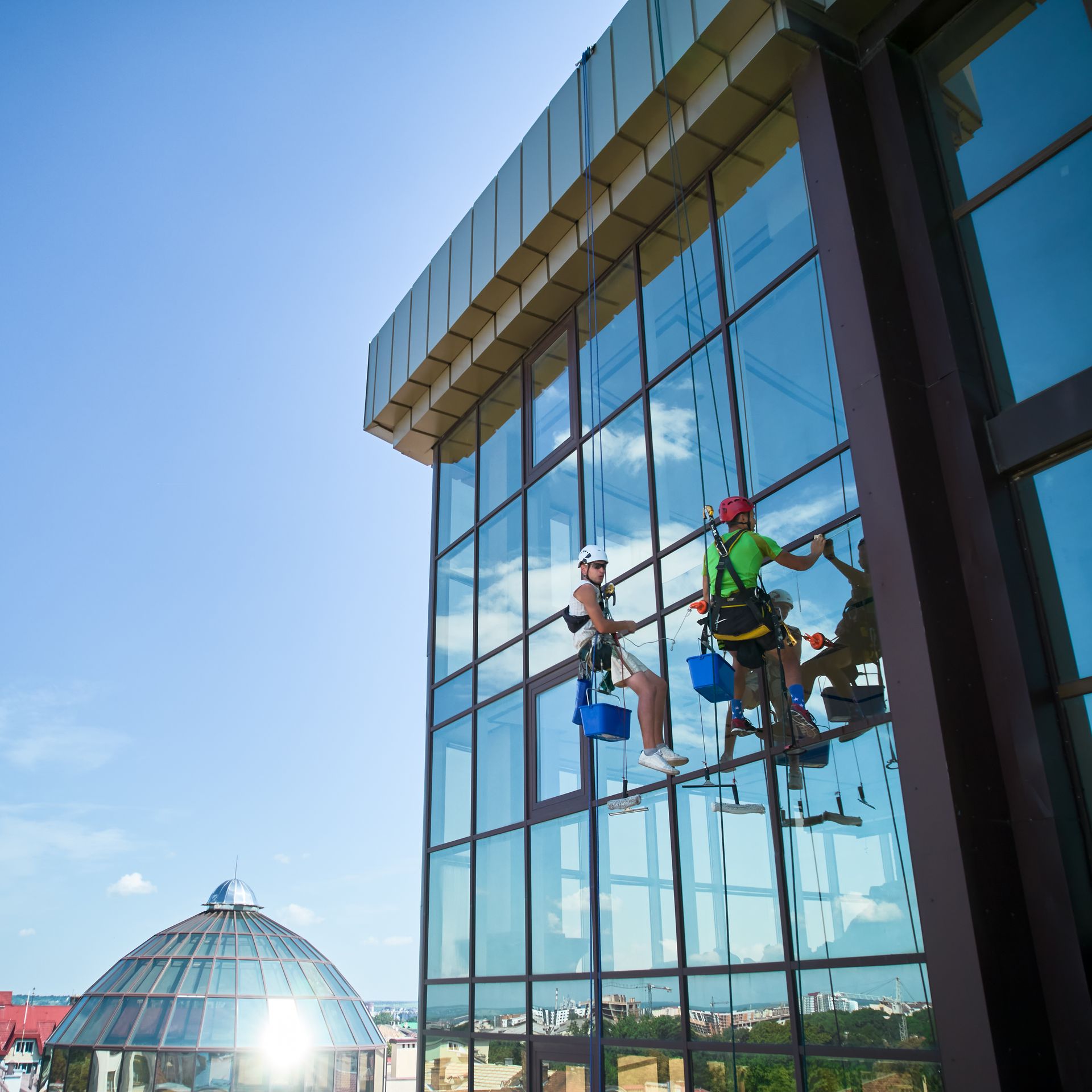 2 Guy Cleaning a Window