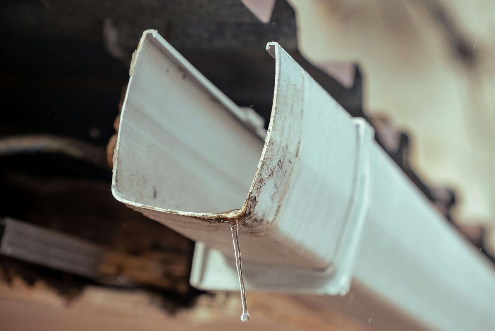 a gutter dropping an water