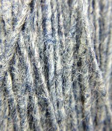 A close up of a ball of blue and white yarn.