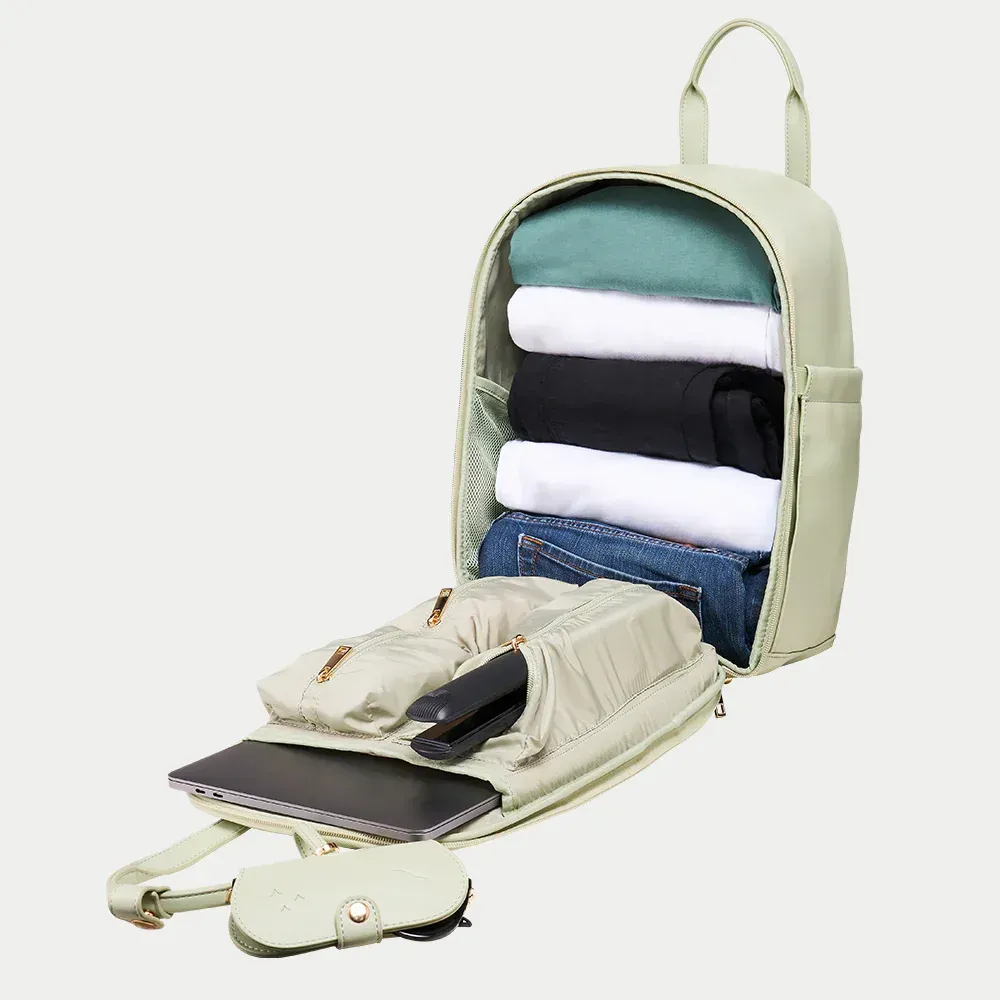 A backpack filled with clothes and a laptop