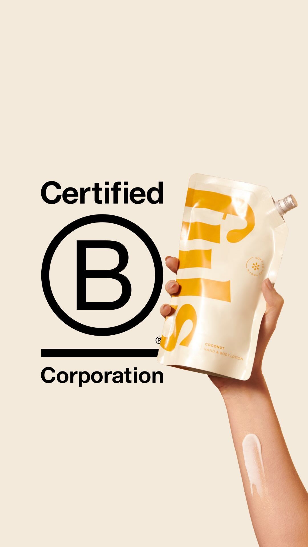 A person is holding a bottle of Fiils lotion in their hand with B Corp Logo