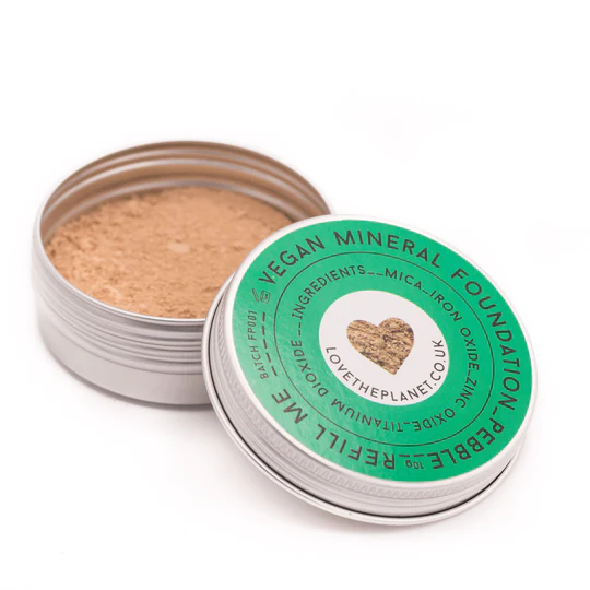 A tin of vegan mineral foundation with a heart on it