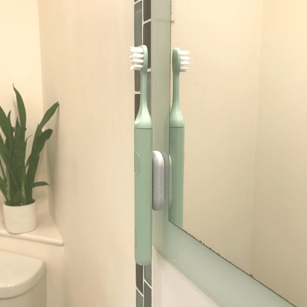 toothbrush on magnetic wall mount
