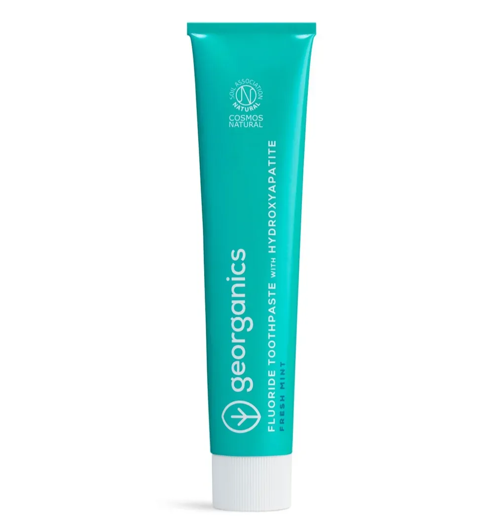 Turquoise tube of georganics fluoride toothpaste with hydroxyapatite.