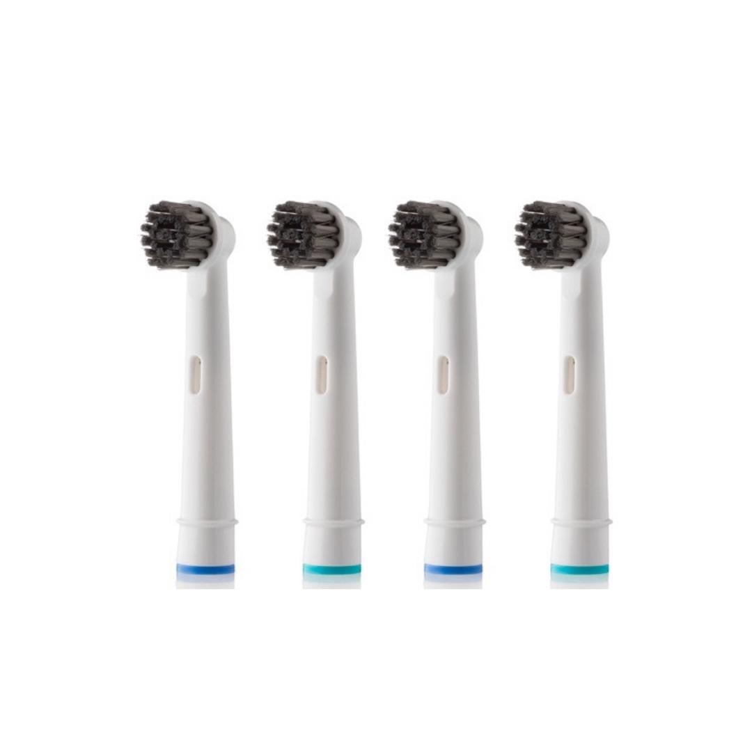 Four electric toothbrush heads are lined up in a row on a white background.