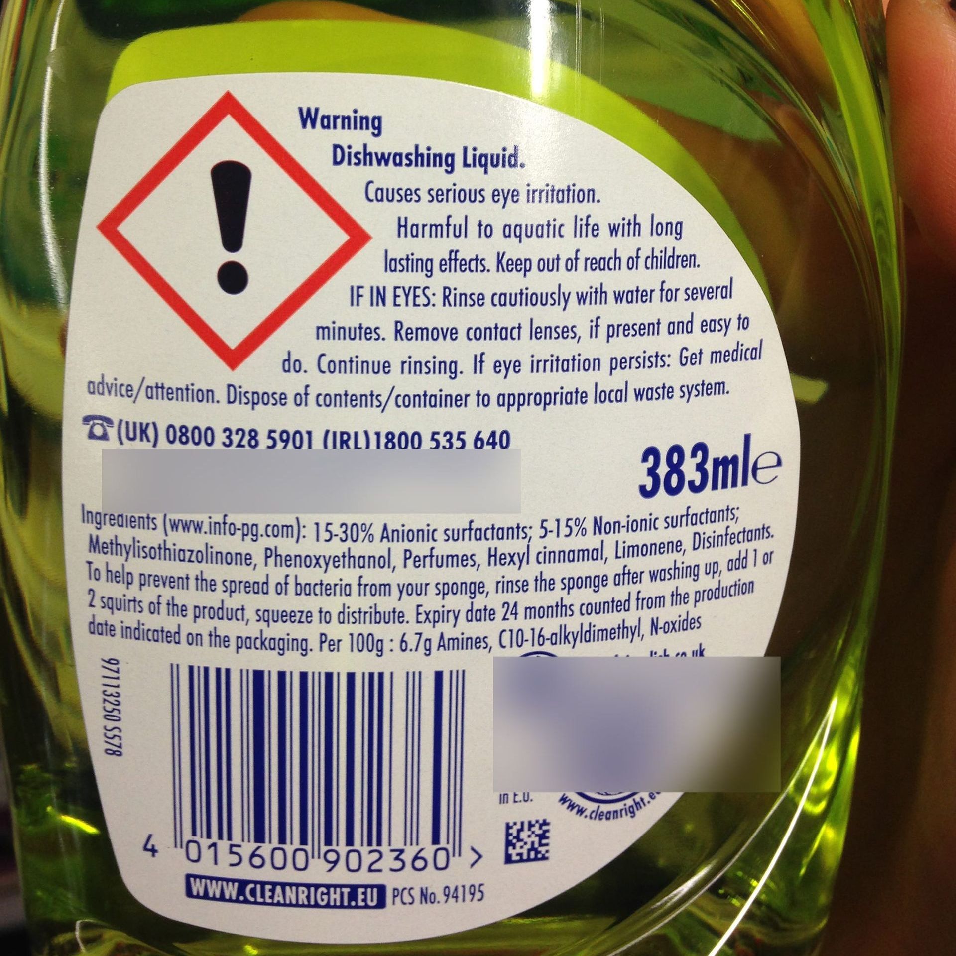 A bottle of dishwashing liquid has a warning label on it