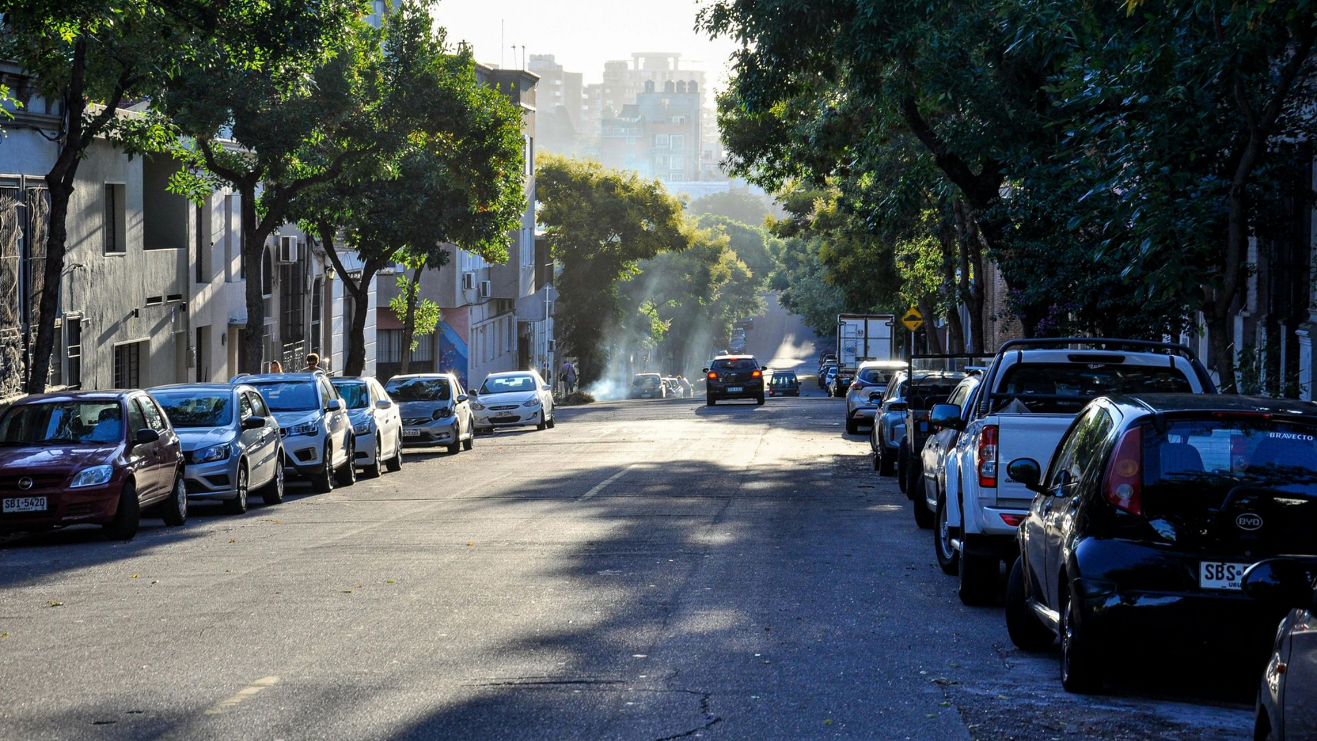 Roll of insulation material on a stone surface; beige and brown fibers are visible.