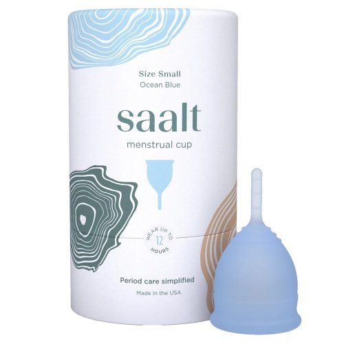 A saalt menstrual cup is sitting next to its box.