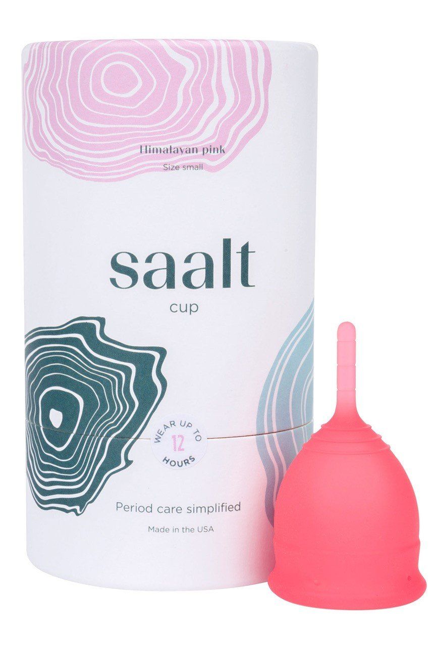 A pink saalt cup is sitting next to its box