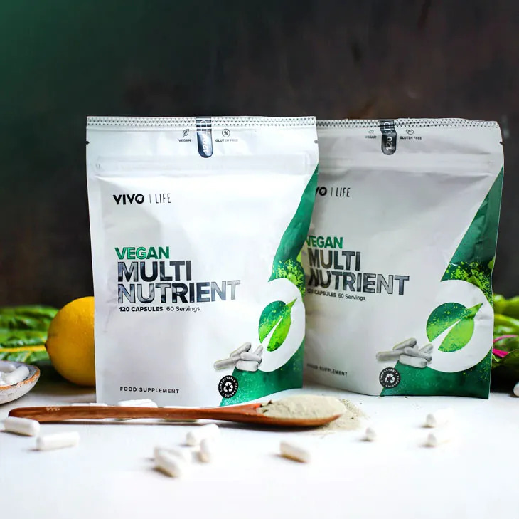 Two bags of vegan multi nutrient are sitting on a table.