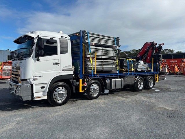 Crane Truck Loading Scaffolding — Mick's Towing Service Pty Ltd in Carrara, QLD