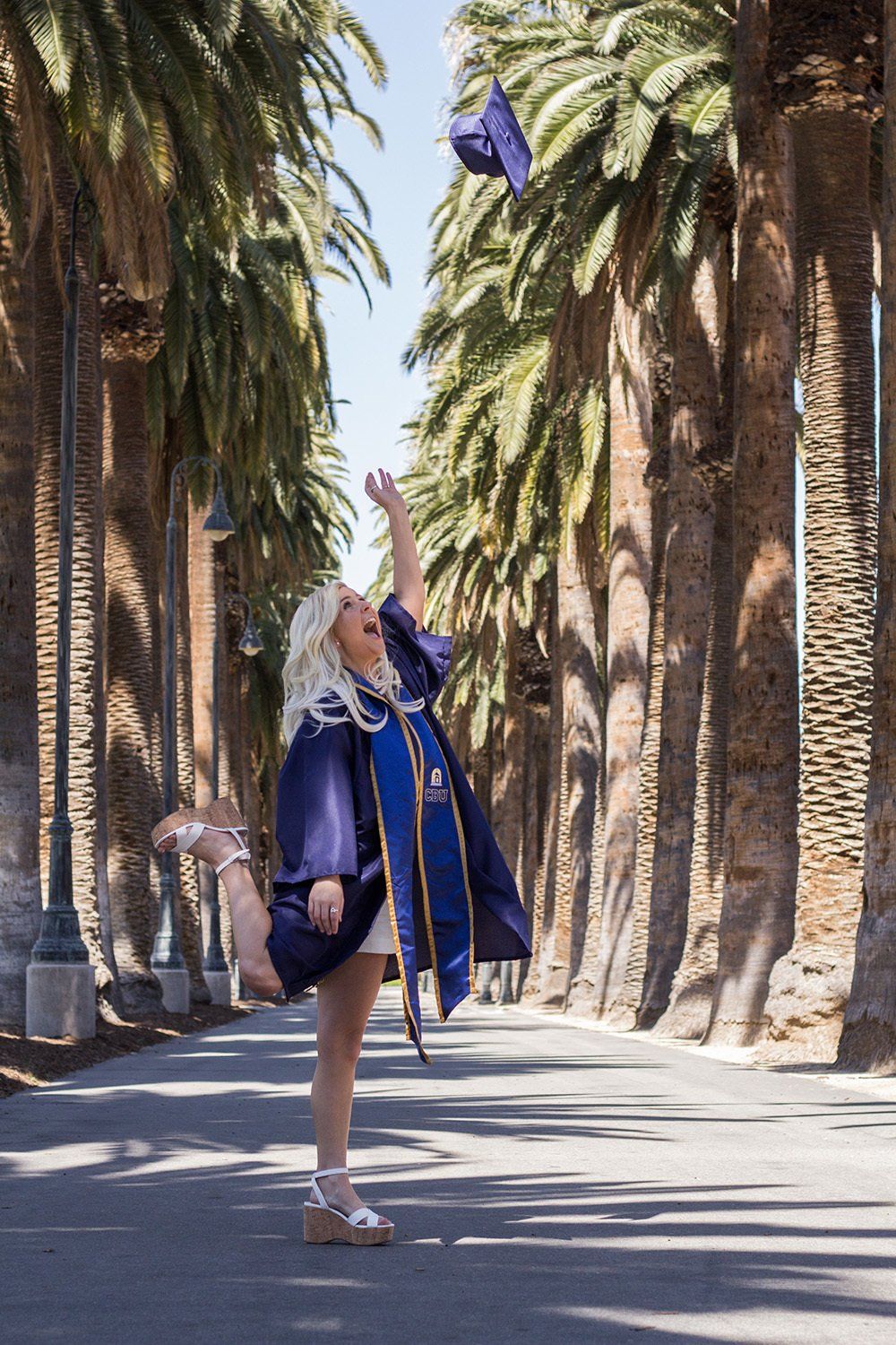 throwing graduation cap in air