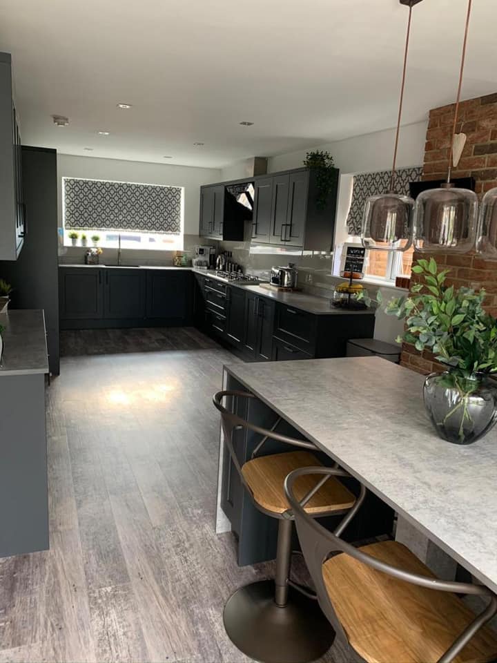 grey kitchen with breakfast bar