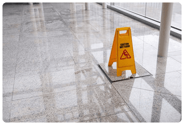 A yellow wet floor warning sign