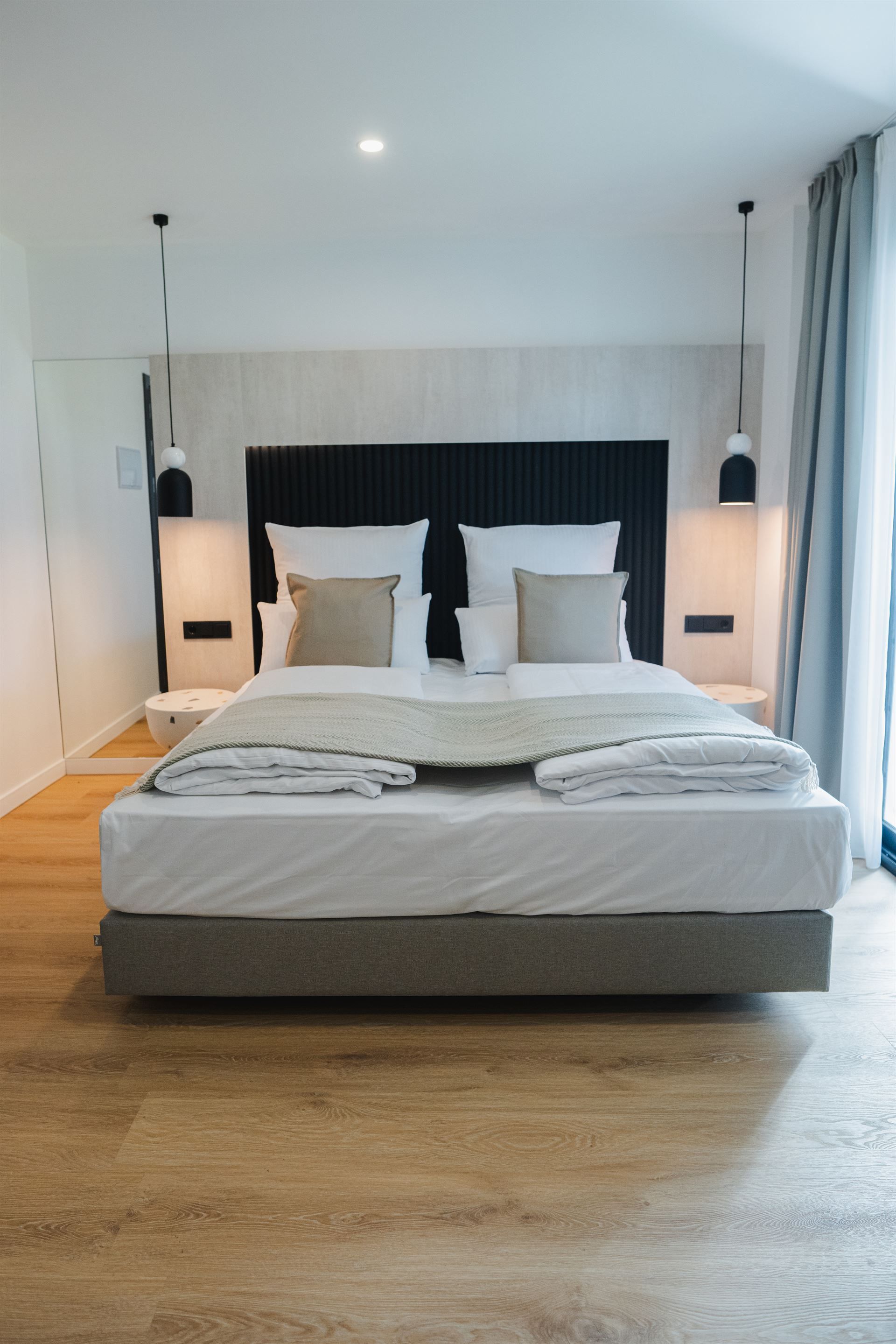 There is a large bed in the middle of the room.