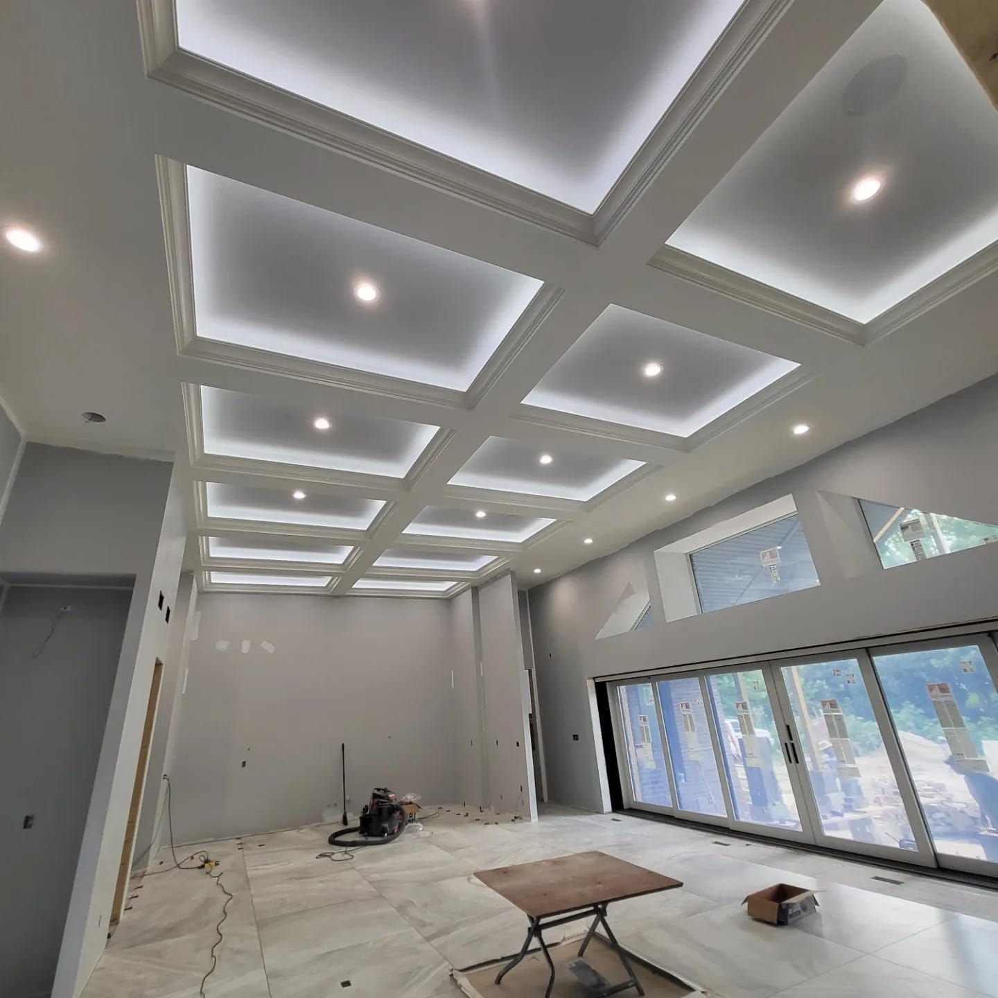 A large room with a ceiling that has a lot of lights on it.