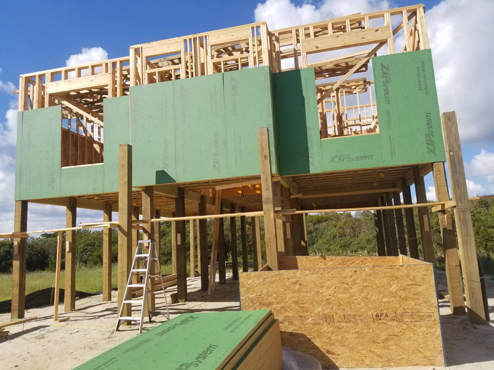A house that is being built with green boards