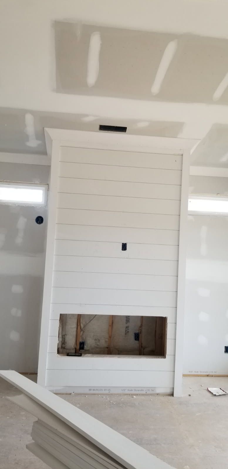 There is a fireplace in the middle of the room.