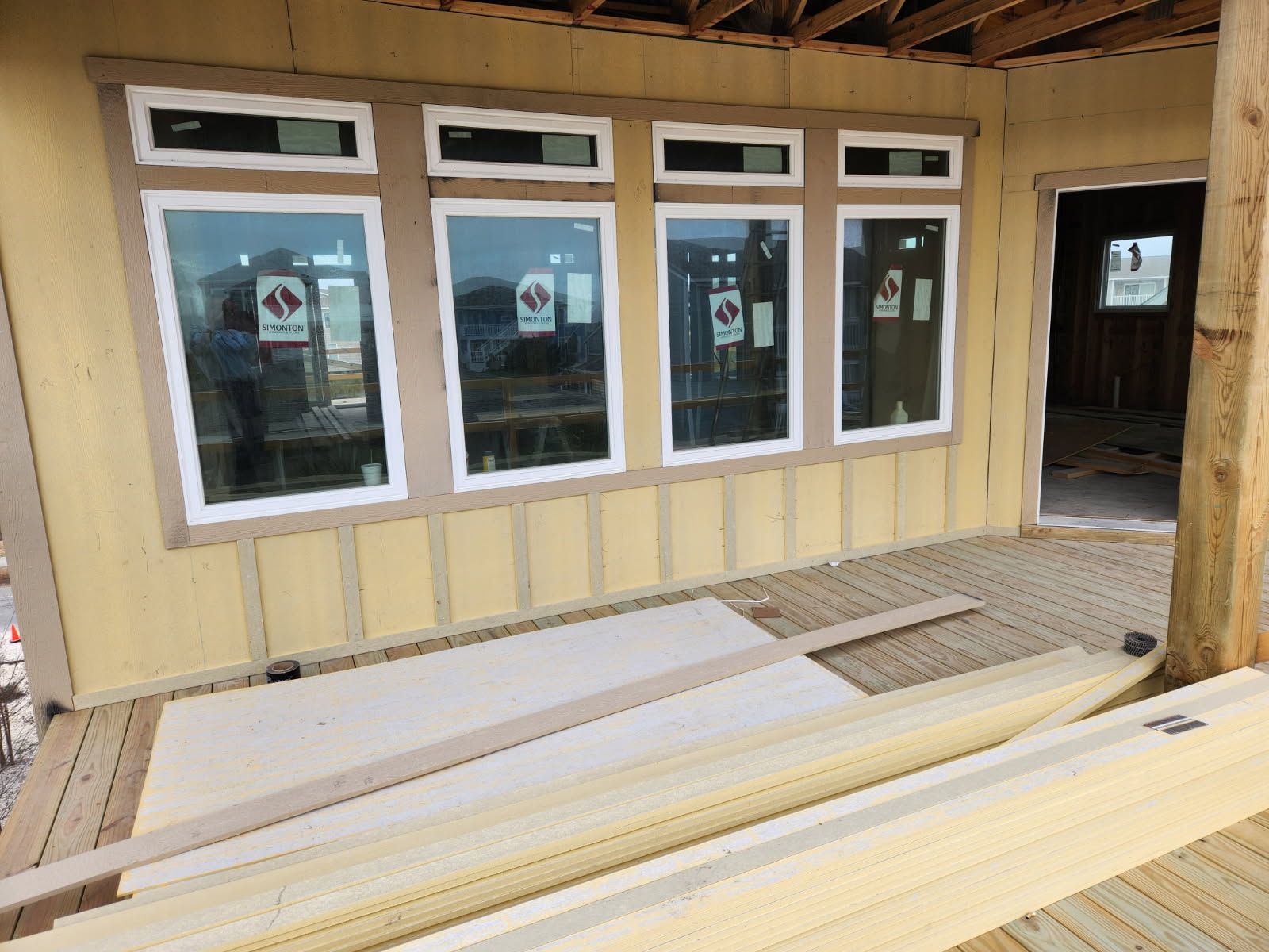 A house is being built with a lot of windows.