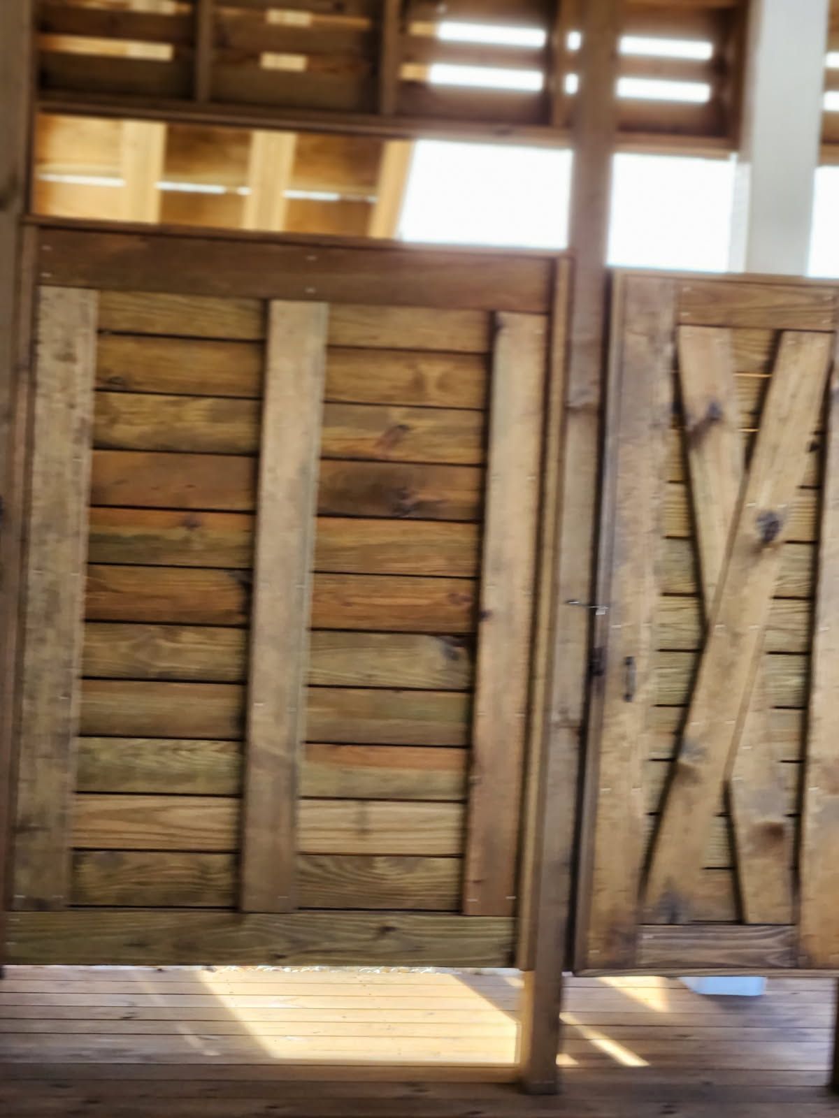 A wooden door with a x on it