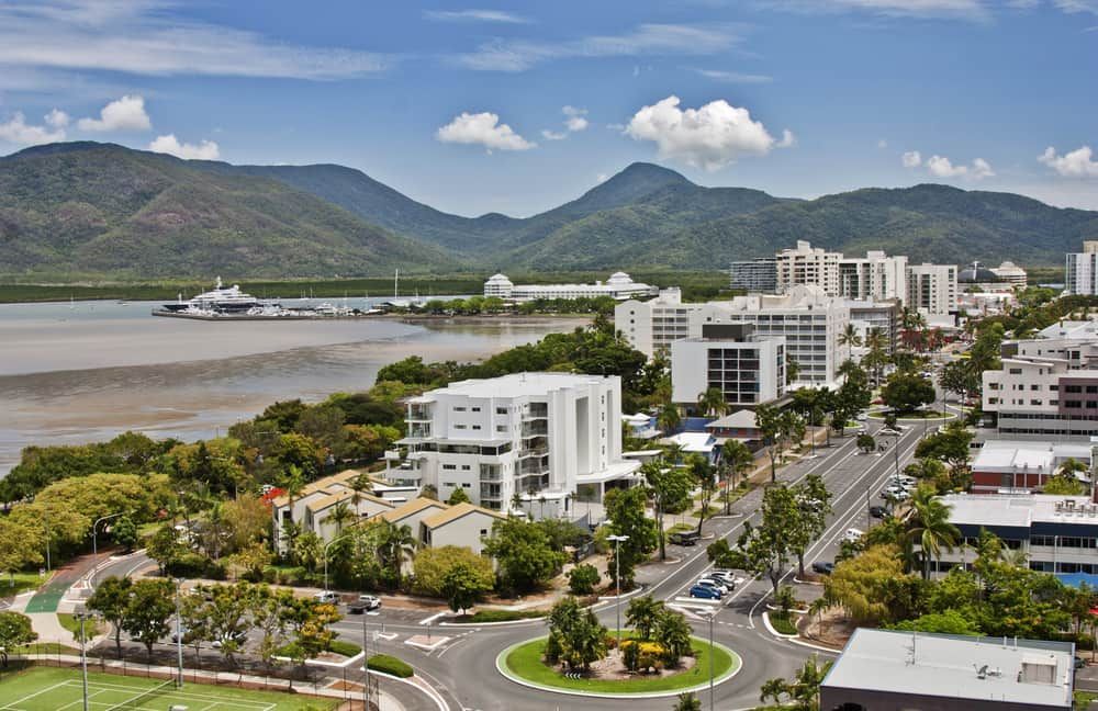An Aerial View Of A City With Mountains In The Background — Doug Simpson Piano Tuning In Cairns, QLD
