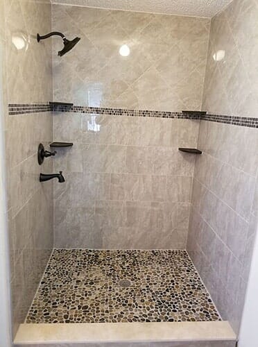 Bathroom in nice tile flooring and wall - flooring contractors in Jacksonville, FL