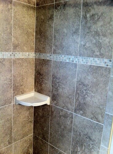 Corner of bathroom with nice tiles - flooring contractors in Jacksonville, FL