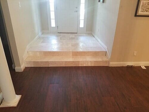 House entrance interior with marble and hardwood flooring - flooring installations in Jacksonville, FL