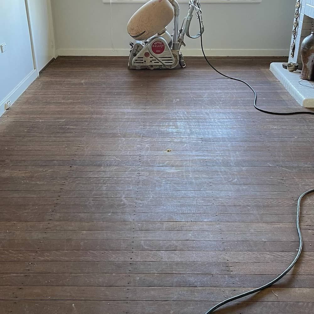 Sanding a Wooden Planks with a Sanding Machine — Floor Sanding in Kearneys Spring, QLD