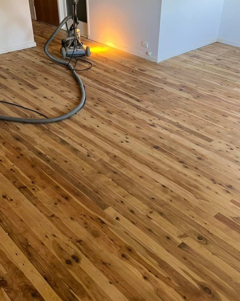Floor Polishing Machine on Wooden Floor with Yellow Light on it — Floor Sanding in Kearneys Spring, QLD