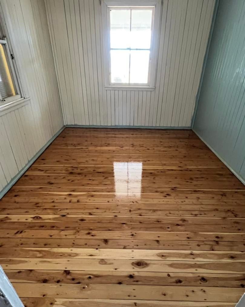 Polished Room Floor with a Window and a Reflection on Floor — Floor Sanding in Kearneys Spring, QLD