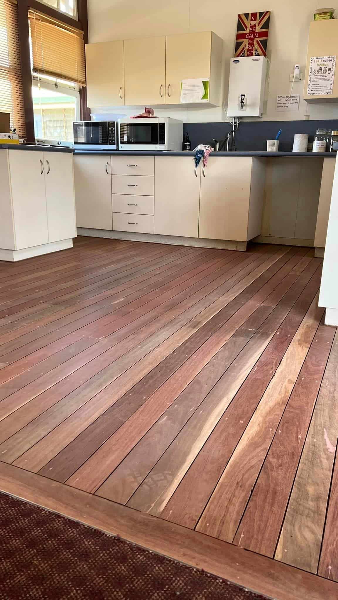 Refined Kitchen Floor with Shelves and Other Utensils above it — Floor Sanding in Kearneys Spring, QLD