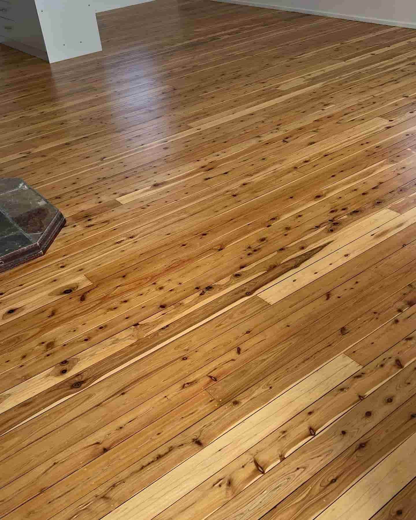 Shiny Timber Wooden Floor with Layers of Stain — Floor Sanding in Kearneys Spring, QLD