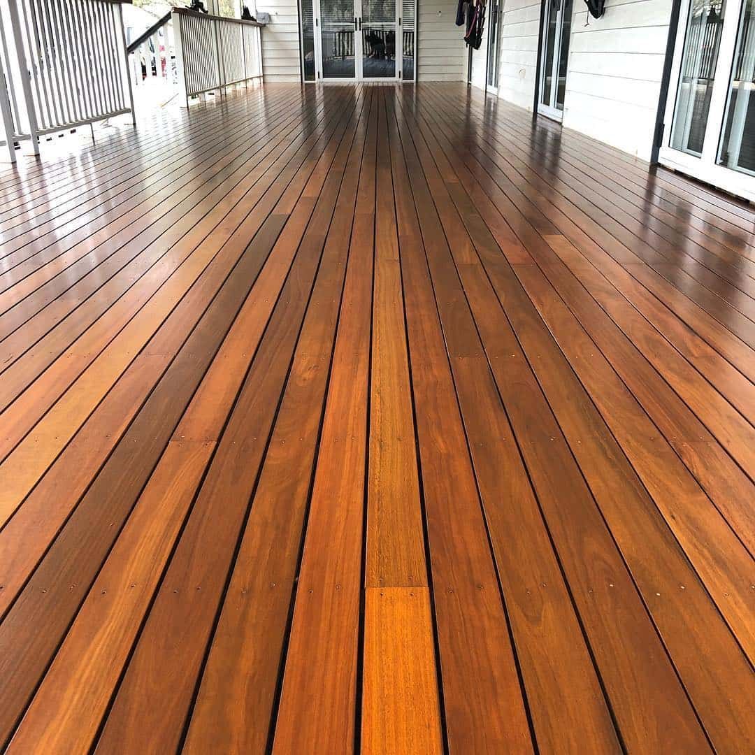 Wooden Flooring with White walls and Railings Behind — Floor Sanding in Kearneys Spring, QLD