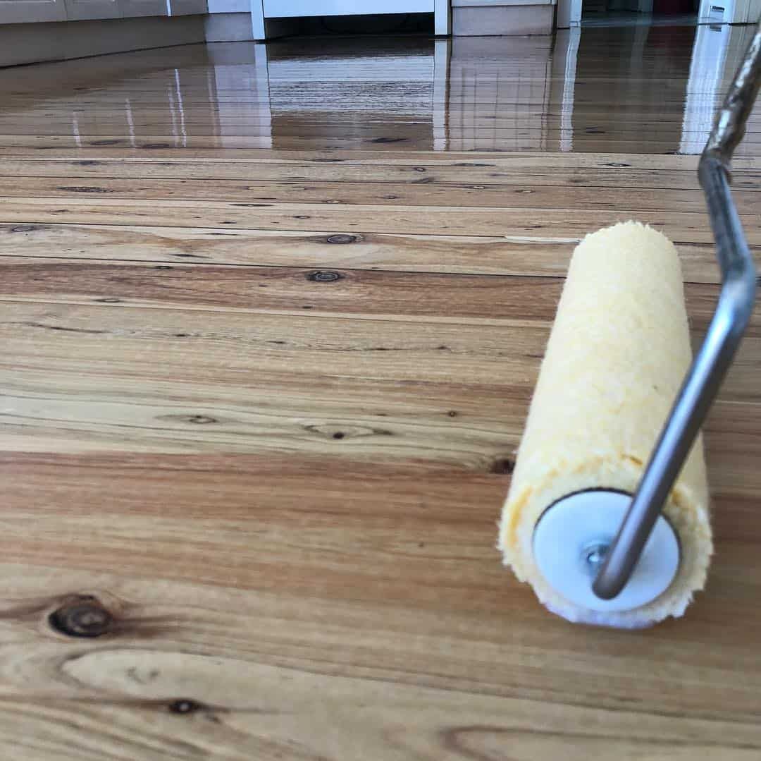 Applying Floor Coat With Paint Roller — Floor Sanding in Dalby, QLD