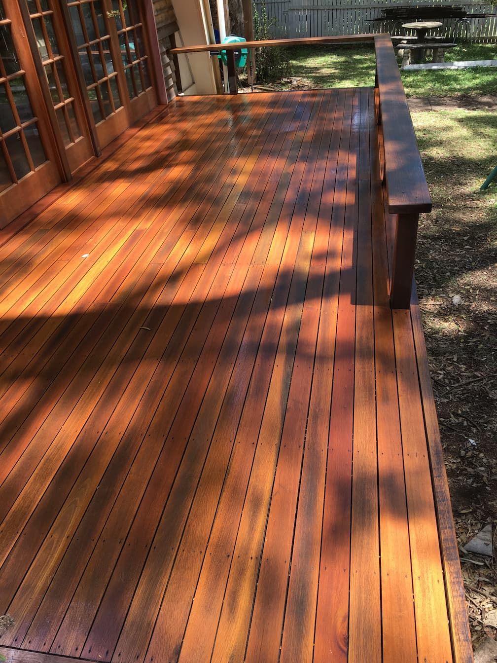 Outdoor Timber Floor with Sun Rays Falling on it — Floor Sanding in Kearneys Spring, QLD