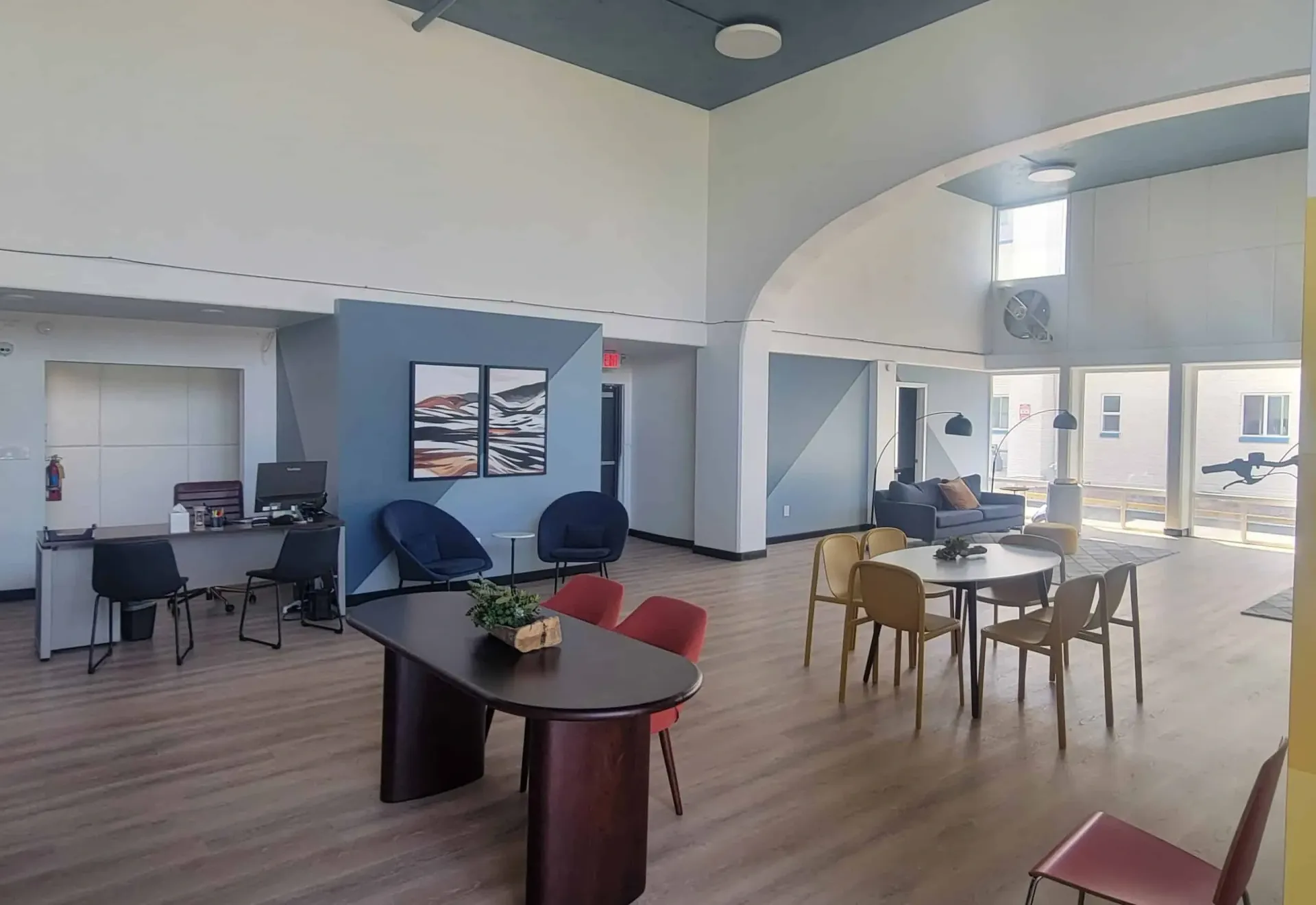 Community lounge area with seating and reception desk.