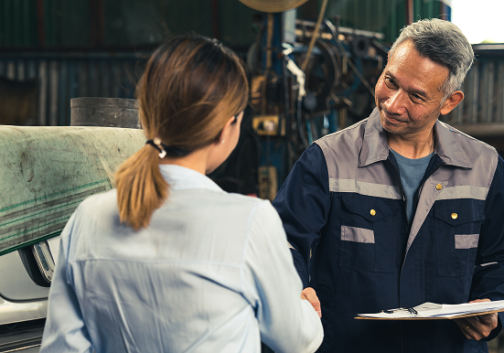 Customer and mechanic shaking hands | Iberia Discount Tire