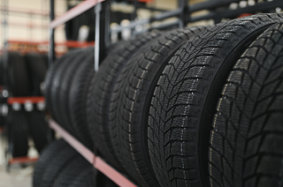 Row of tires on rack | Iberia Discount Tire