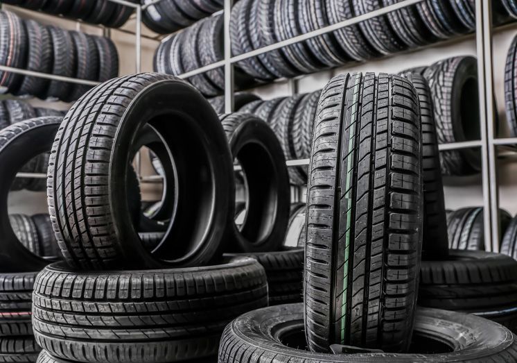 Rows of tires and tires in center, stored | Iberia Discount Tire