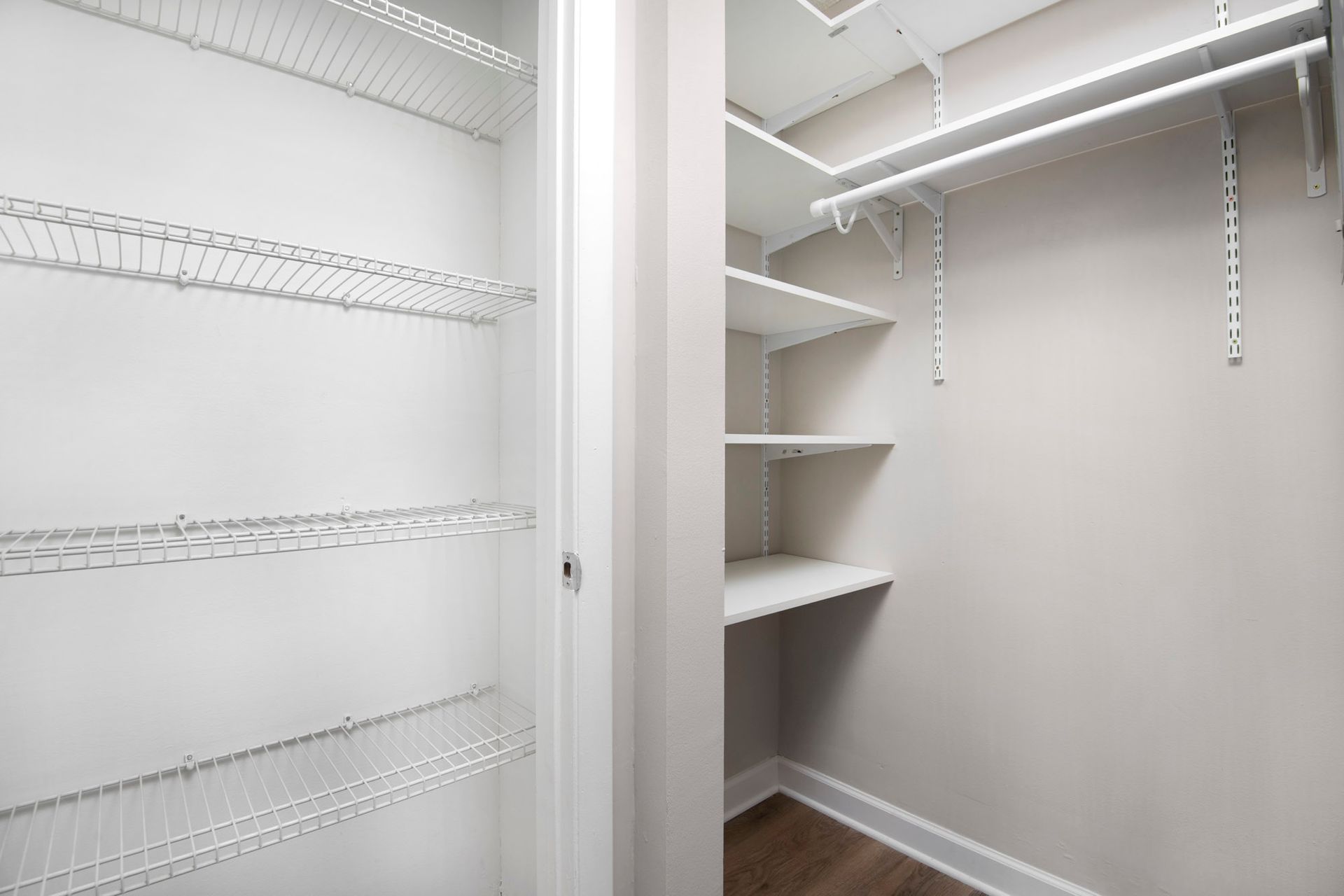 An empty walk-in closet with shelves and a door at Reside at Belmont Harbor. 