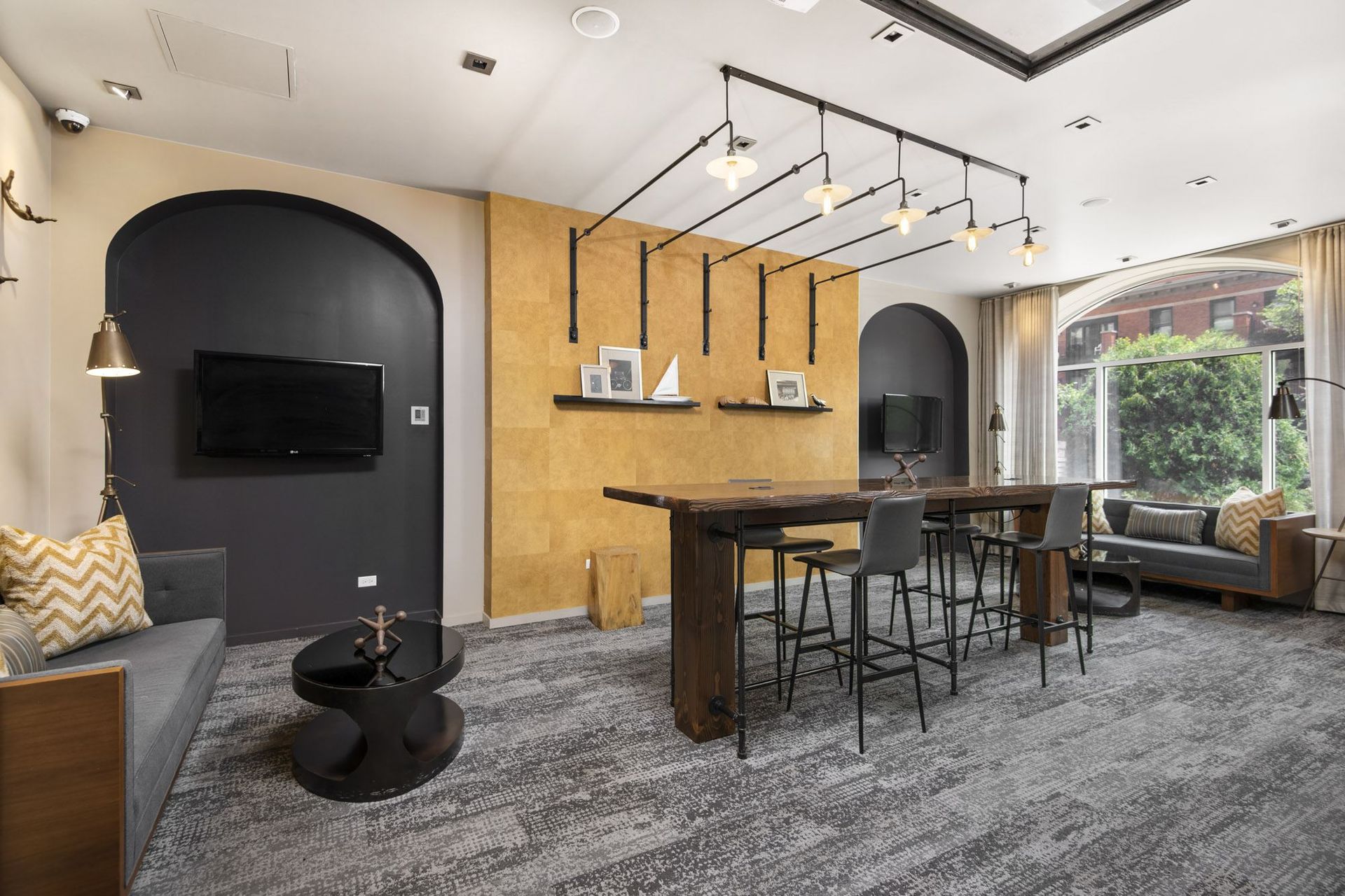 a living room with a table and chairs and a tv