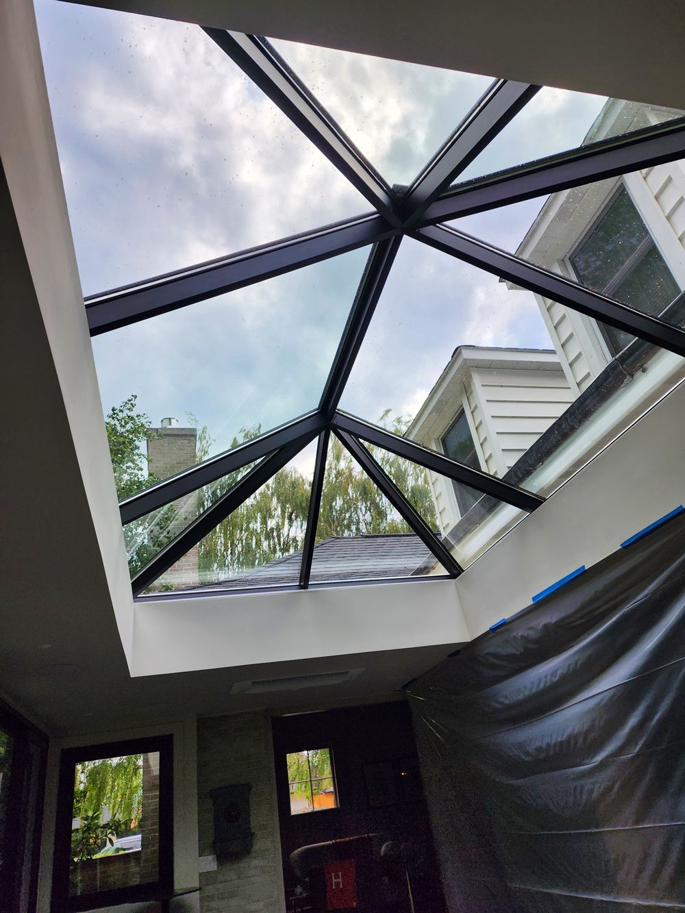 A large skylight in the ceiling of a house.