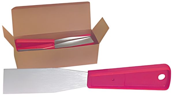 A spatula with a red handle is sitting next to a box.