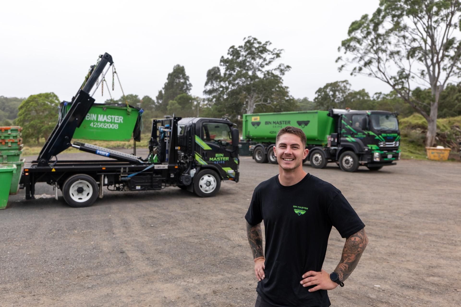 Green dumpster outdoors.