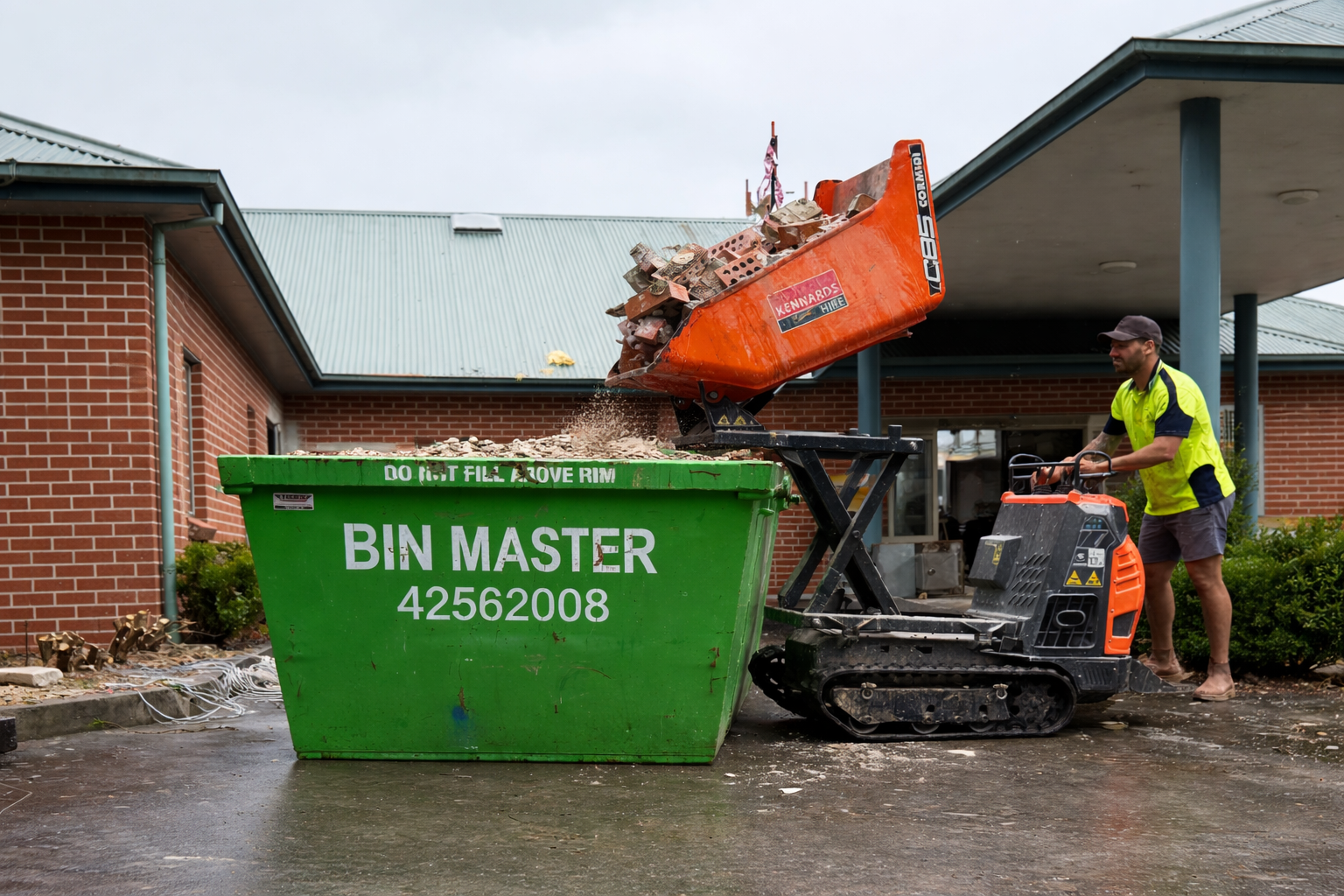Lime green dumpster overflowing with debris being lifted by a truck in a residential driveway.